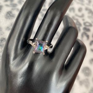 Looks like mystic topaz …but costume jewelry so maybe a crystal